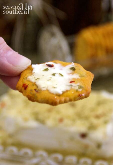 A close up of Garlic Pepper Jelly spread on a cracker.