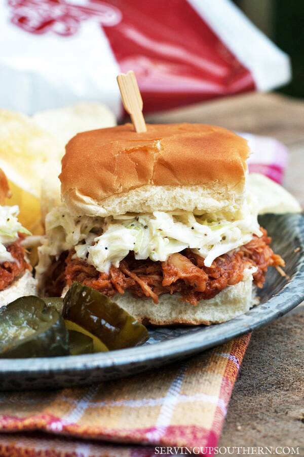 Slow Cooker Pulled Barbeque Chicken Sliders with Quick Creamy Slaw served on a plate.