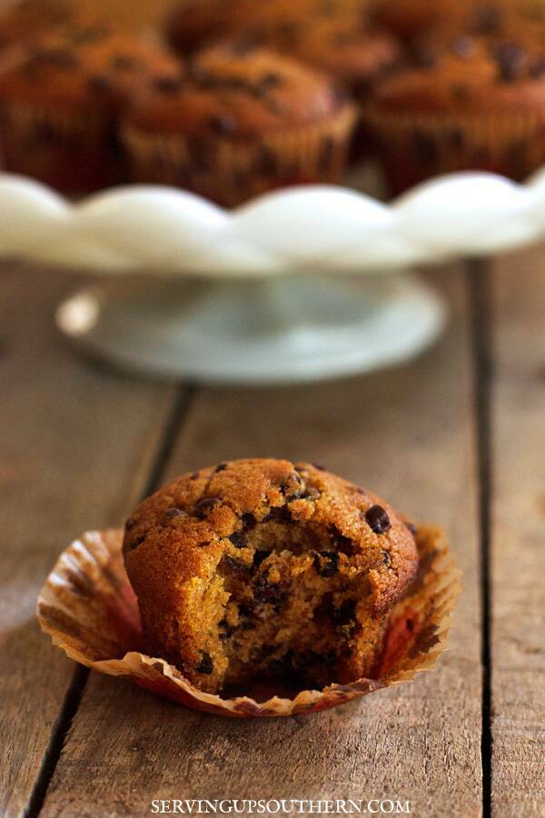 Pumpkin chocolate chip muffin on a wooden board