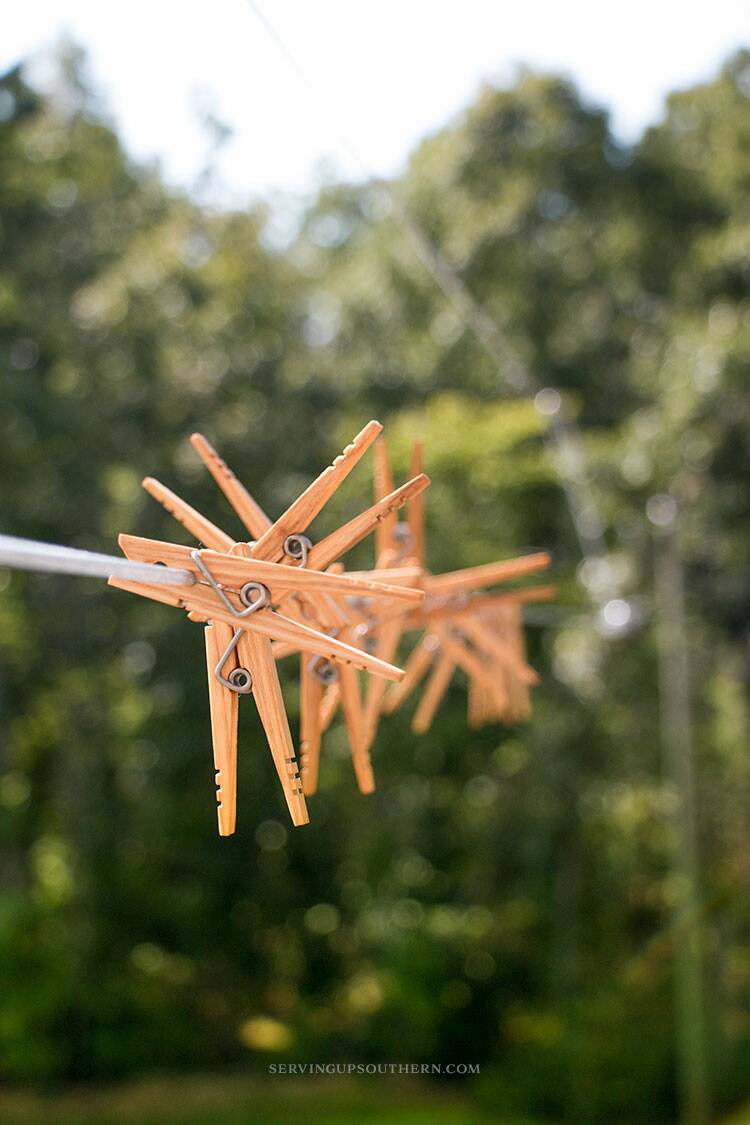 Hang pictures with fishing line and clothes pins!