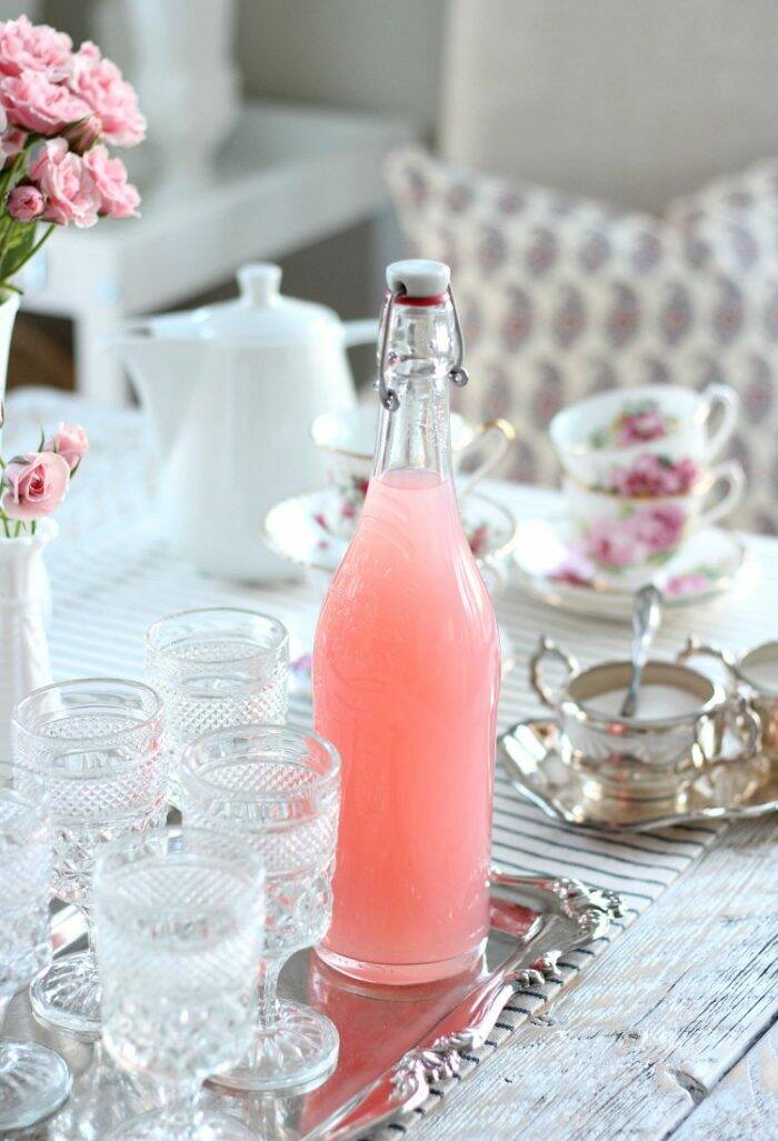 Valentine's table setting with beautiful dishes, glasses, and tea cups.