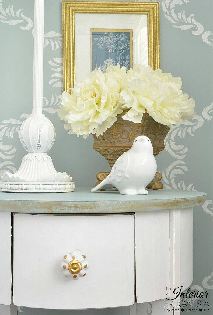 homestyle gathering 8 white and aqua bedside table with lamp and white bird and yellow flowers in vase