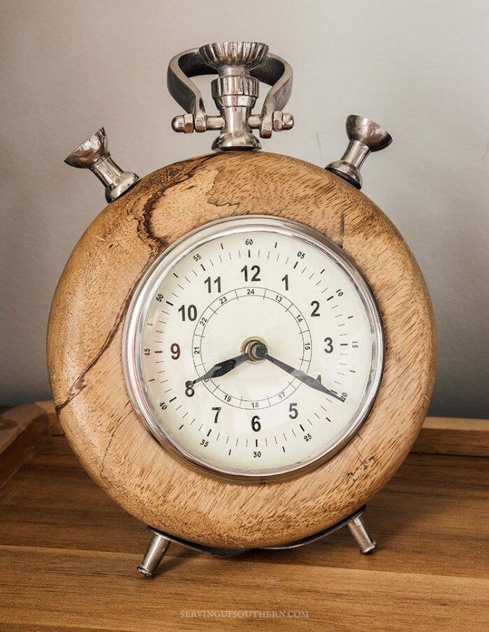 Wooden clock sitting on a tray