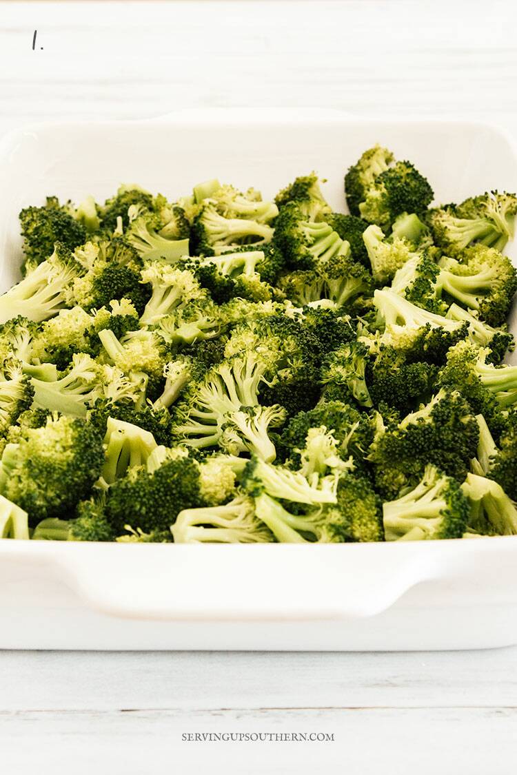 White casserole dish filled with lightly steamed broccoli