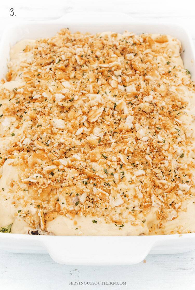 White casserole dish of chicken divan waiting to be baked..